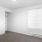 a room with white walls and a light on the ceiling