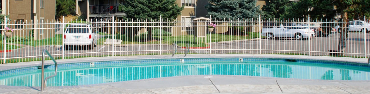 fenced in, outdoor swimming pool