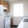 a kitchen with white appliances