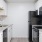 a kitchen with white cabinets