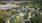 aerial view of a property with trees surrounding